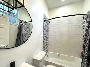 Combined shower/tub, hair dryer, towels, soap