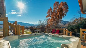 A hot tub with a wooden deck and a view of mountains and trees. - EpicViews!~EasyRoads!~HotTub~FirePlace~Firepit (Sevierville)