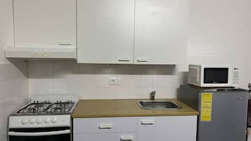 Apartment, 1 Queen Bed | Private kitchen | Fridge, microwave, oven, stovetop