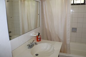 Grand Apartment | Bathroom | Bathtub, towels, toilet paper - Ocean View Apartments (Rockley)