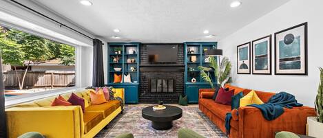 TV, fireplace, books, offices