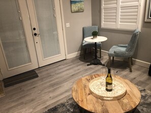 Relax in comfort with a round coffee table, a quiet reading nook, and plush seating for casual gatherings.
