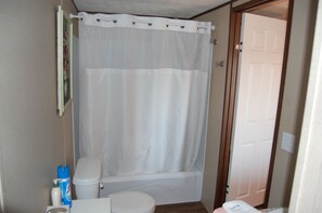Combined shower/bathtub, hair dryer, towels, soap