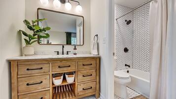 Bathtub, hair dryer, towels, soap