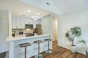 Fridge, microwave, oven, stovetop - Stylish Uptown condo in Historic 4th Ward! (Charlotte)