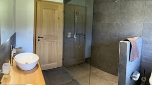 Shower, hair dryer, towels, toilet paper
