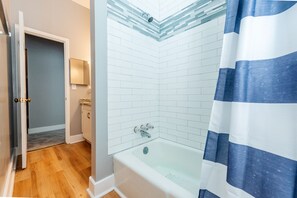 Combined shower/tub, hair dryer, towels, soap
