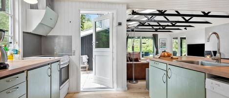 Fridge, stovetop, dishwasher, coffee/tea maker