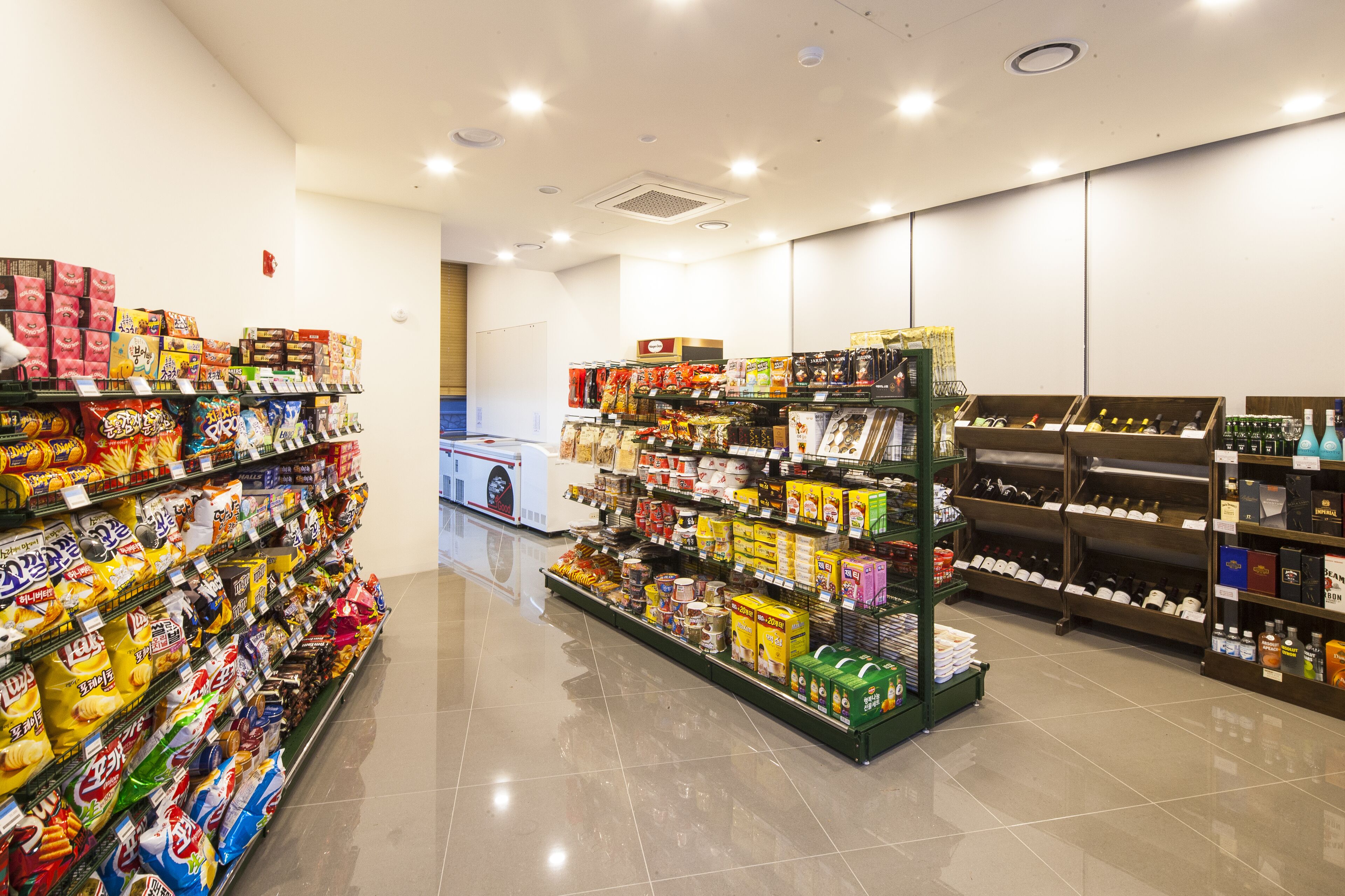 A supermarket aisle with various packaged goods and beverages.