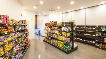 A supermarket aisle with various packaged goods and beverages.