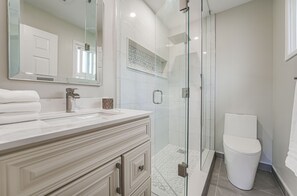Bathtub, hair dryer, towels, soap
