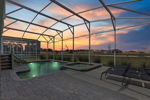 Relax by the pool surrounded by a transparent roof and breathtaking views of the surrounding landscape.