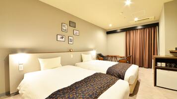 Chambre Deluxe avec lits jumeaux, non-fumeurs | Couette en duvet d'oie, rideaux occultants, Wi-Fi gratuit, draps fournis