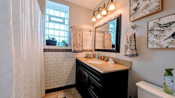 Combined shower/bathtub, hair dryer, towels, soap