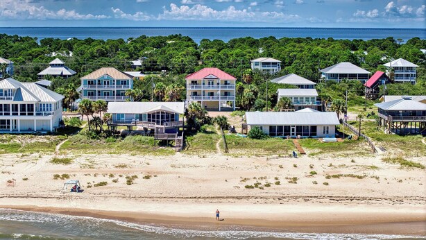 A coastal area with beachfront houses, a sandy beach, and a view of the ocean. - Paradise Falls here! 4 BR, Elevator, Pool, across the street from beach (ST GEORGE ISLAND)