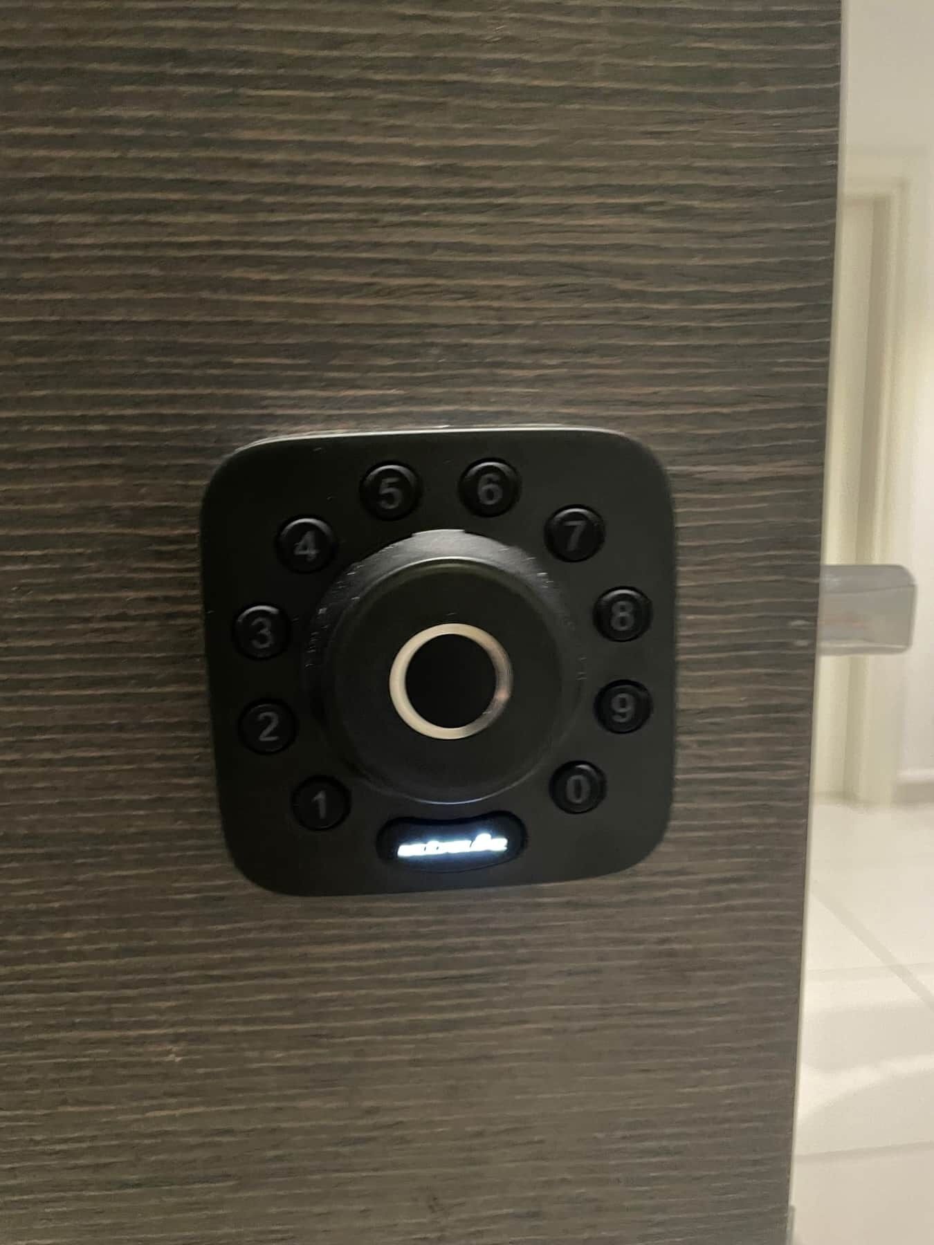 A keypad lock on a door.