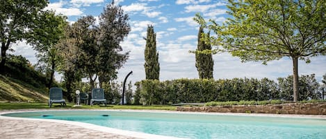 Seasonal outdoor pool, open 8:00 AM to 8:00 PM, pool umbrellas