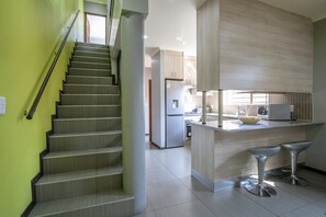 Comfort House | Living area | 32-inch TV with digital channels, Netflix, streaming services - Howard Davis 28B by CTHA (Cape Town)