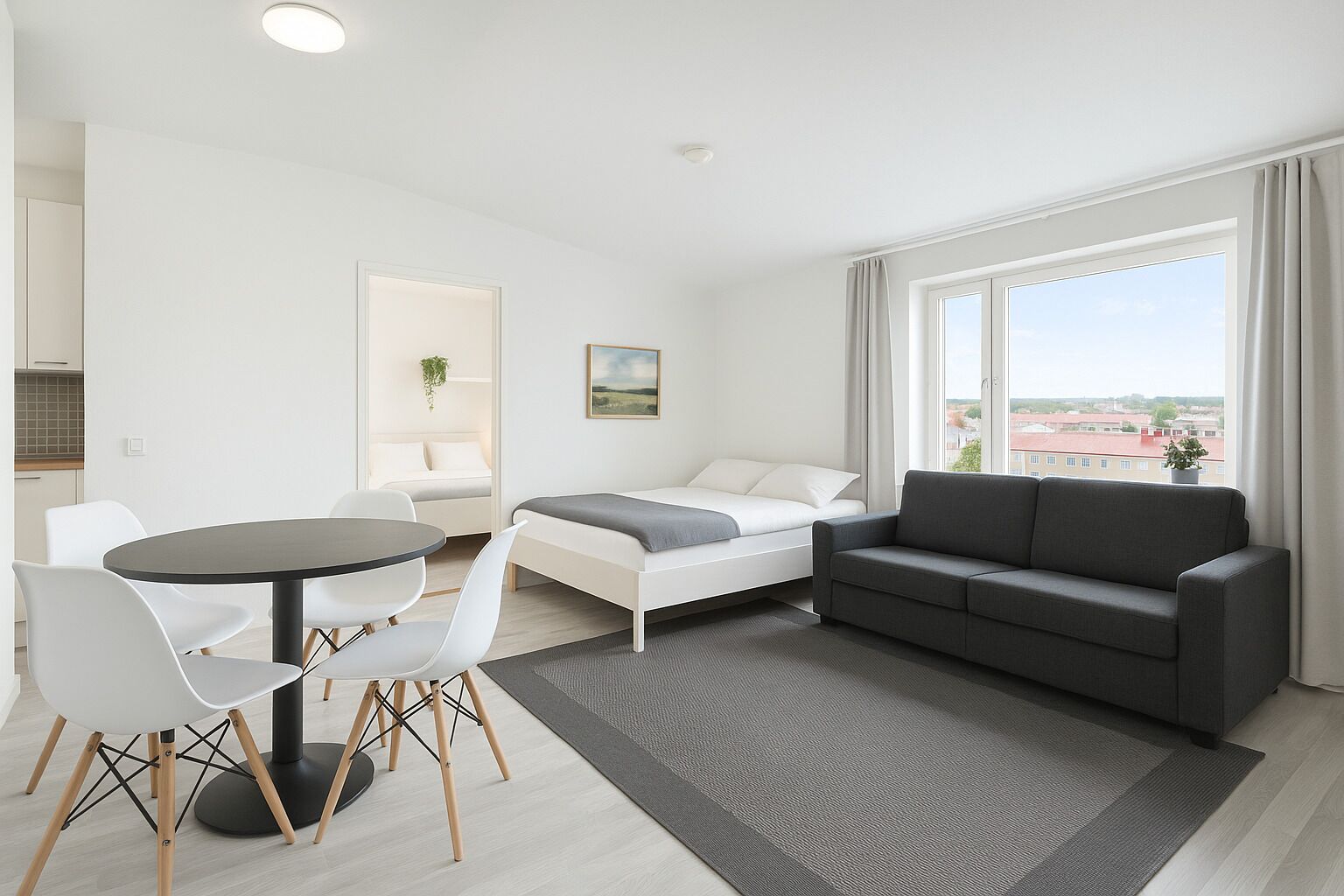 A modern, well-lit room with a dining area, a sofa, and a bed.