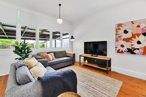 TV, offices - Oasis on Warrendine - Sleek & Stylish Abode (Orange)