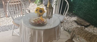 Fenced Studio with private parking ,access to patio and backyard .