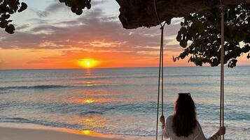 On the beach, sun-loungers, beach towels