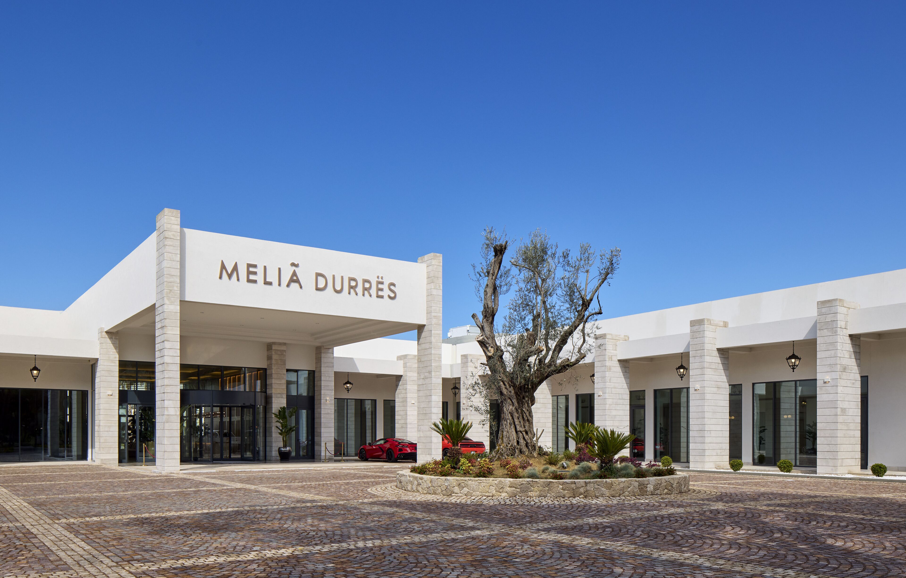 A modern building with a sign reading "MELIA DURRÈS".