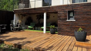 A modern house with a wooden deck, a covered patio, and a balcony. - CONTEMPORARY VILLA WITH AMAZING VIEW OF LAKE SALAGOU (Soumont)