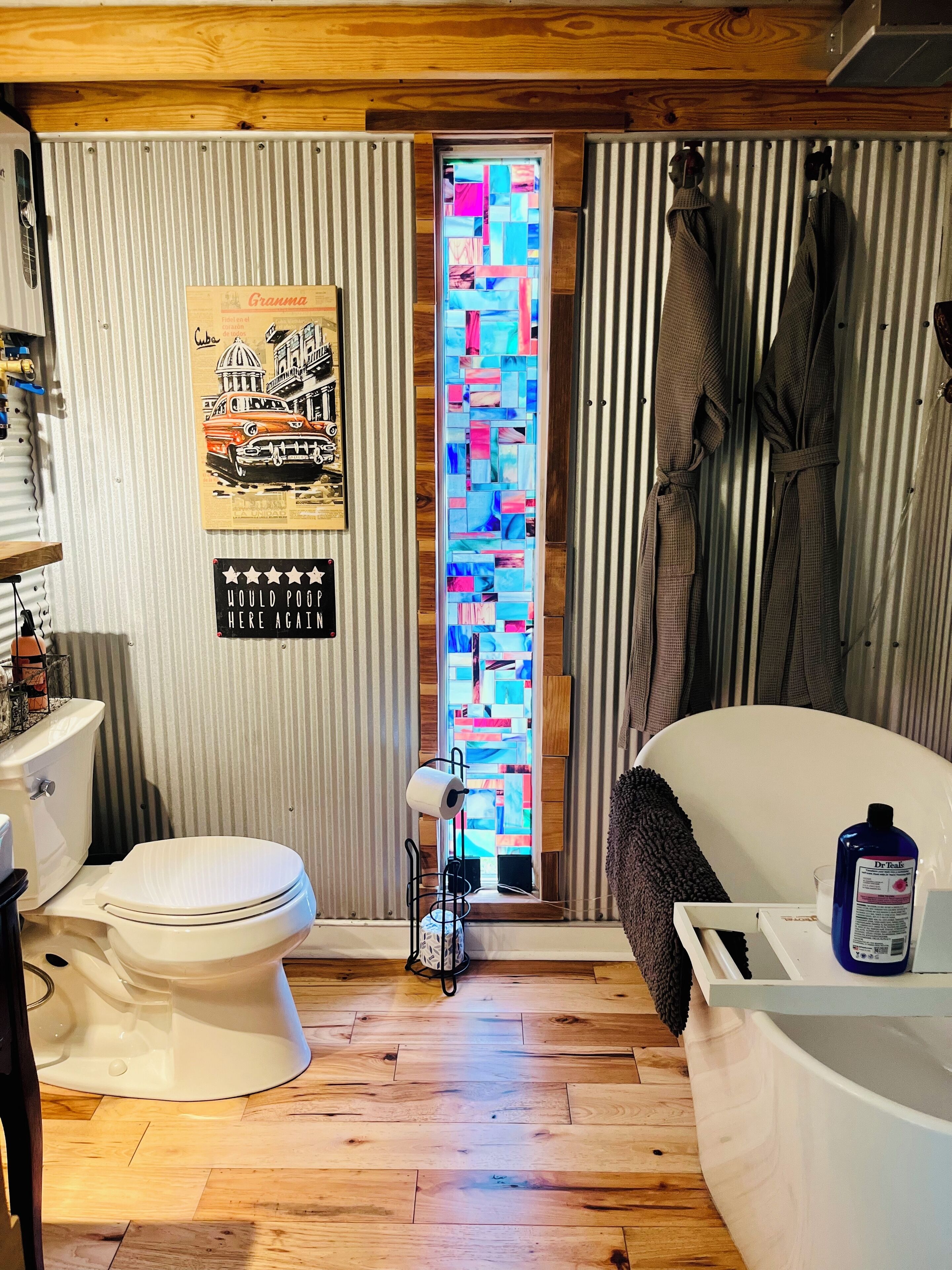 Bathtub, towels, soap, toilet paper