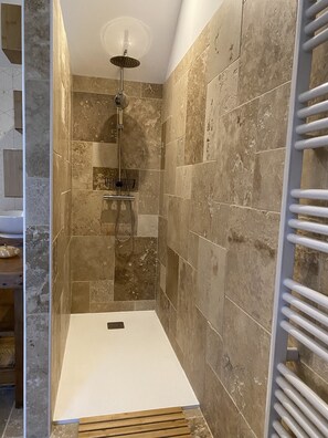 Shower, hair dryer, towels, toilet paper