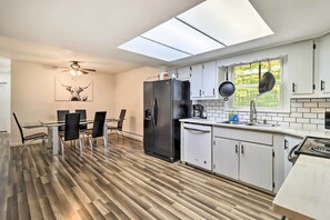 Enjoy cooking in the fully equipped kitchen with a gas stove, dishwasher, and refrigerator.