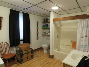 Combined shower/tub, hair dryer, towels, soap