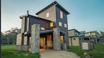 Stunning two-story home with a gabled roof and inviting entrance.