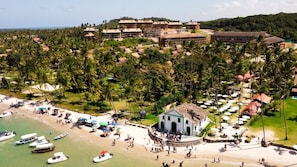 On the beach, white sand, sun-loungers, beach umbrellas