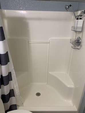 Combined shower/tub, hair dryer, towels, soap