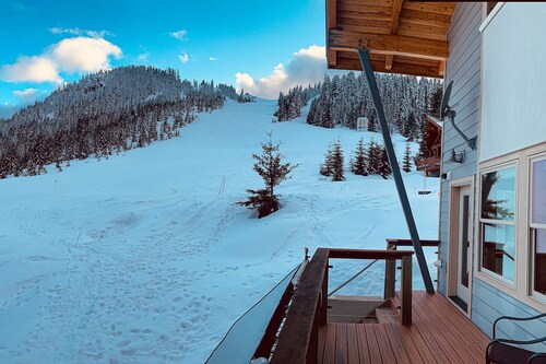Ski-in/ski-out home with mountain-view balcony, multiple living areas, & W/D