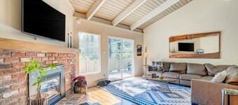 Two-story mountain-view condo with balcony, fireplace & pool - dog-friendly