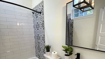 Combined shower/bathtub, hair dryer, towels, soap