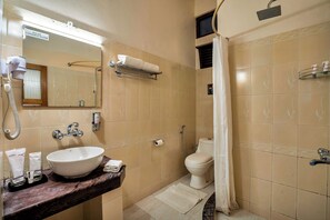 A bathroom with a sink, toilet, and shower. - Sterling Park Kalimpong (Kalimpong)