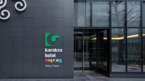 The exterior of the Karaksa Hotel in Tokyo, featuring a modern glass facade and a prominent logo with the hotel's name and location. - Karaksa Hotel Colors Tokyo Yaesu (Tokyo)