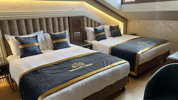 Deluxe Quadruple Room | Premium bedding, down comforters, minibar, in-room safe