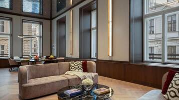 Presidential Studio Suite | Living area | 55-inch Smart TV with digital channels, TV, heated floors