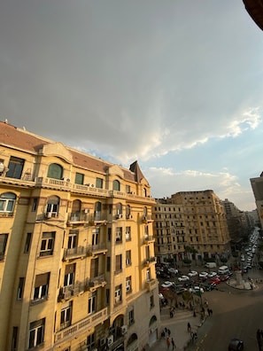 A multi-story building with balconies and a central courtyard. - Gresham Hotel (Cairo)