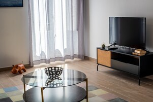 Superior Apartment | Living area | 40-inch Smart TV with digital channels, TV