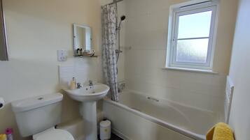 Combined shower/bathtub, hair dryer, towels, soap