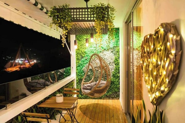 Relax on the balcony with a wicker chair and enjoy the city view.
