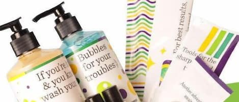 A basket containing various personal care products including bottles and tubes.