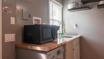 Fridge, microwave, stovetop, coffee/tea maker