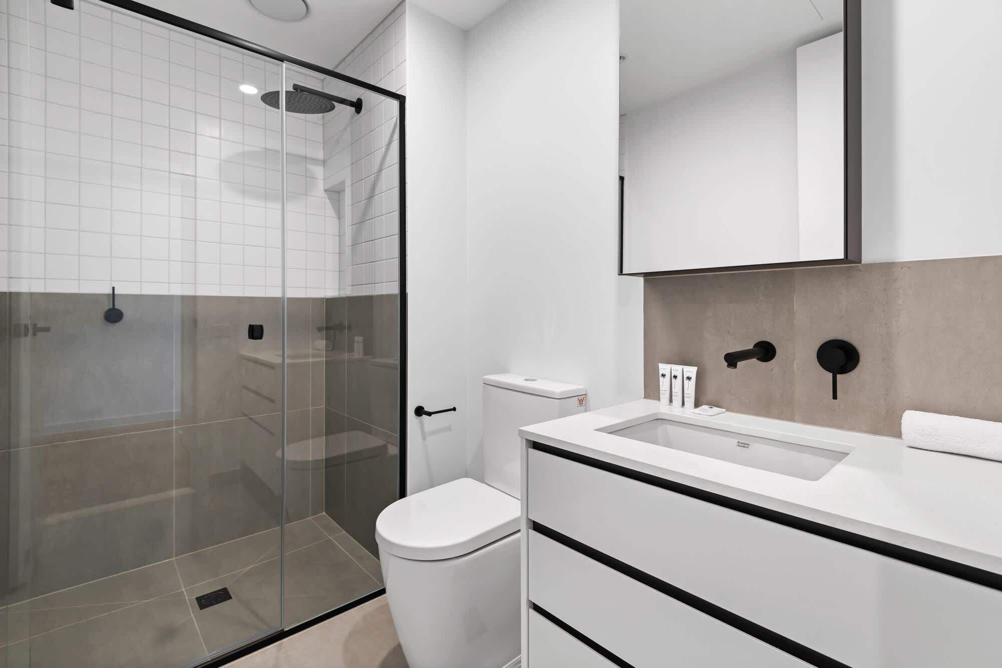 Shower, hair dryer, towels, shampoo