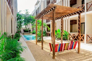 8 outdoor pools, open 8:00 AM to 9:00 PM, pool umbrellas - Smart Depas Tulum (Tulum)